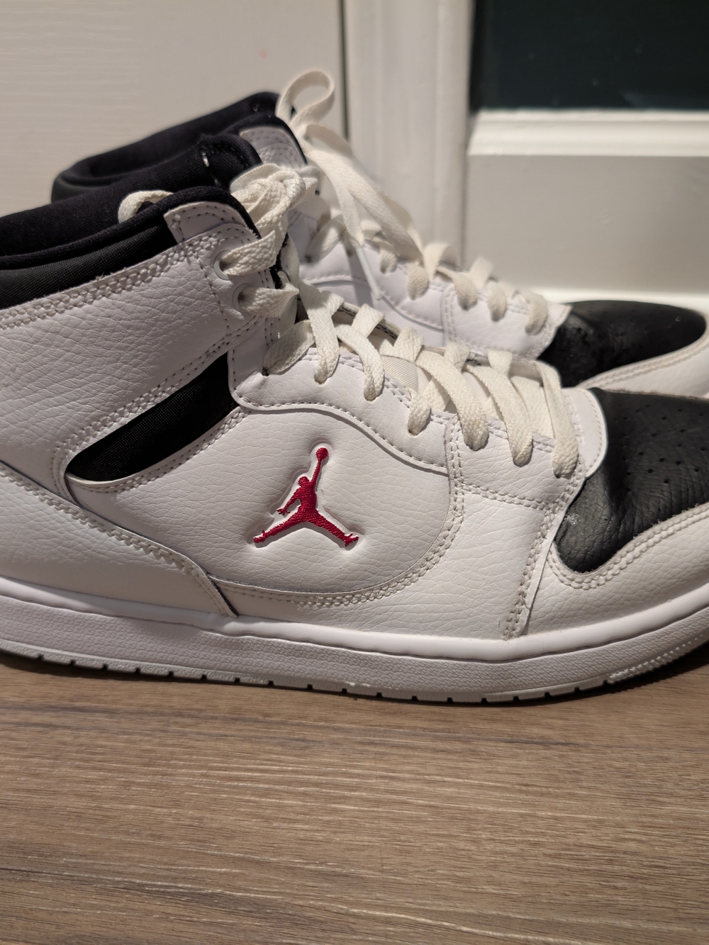Nike White and Black High-Top Sneakers with Pink Jumpman